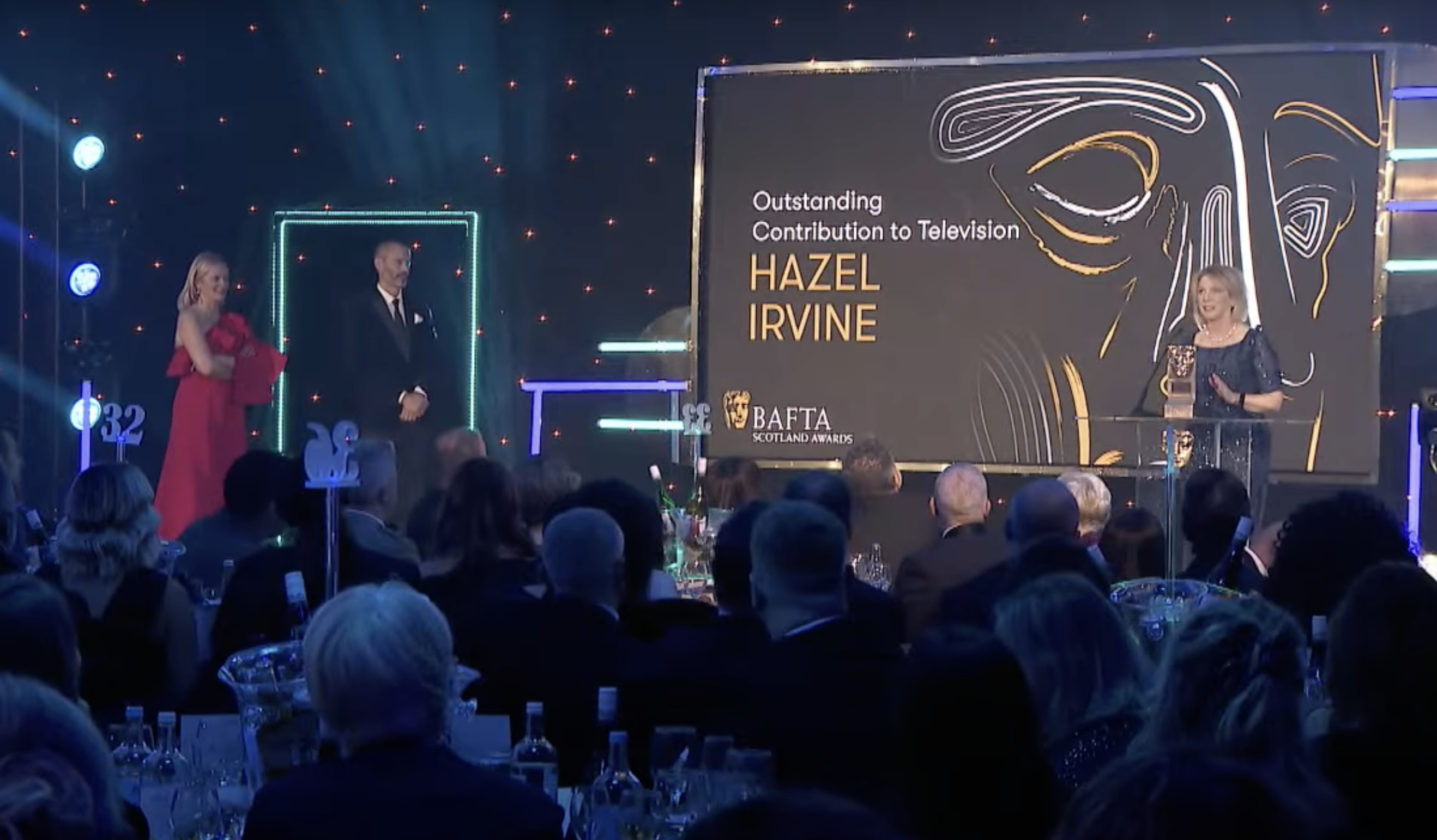 Hazel Irvine collecting an award at the BAFTAS